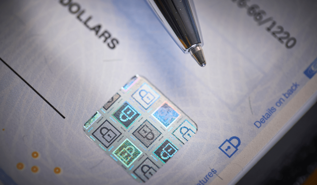 Security hologram on a check to prevent fraud, illustrating advanced measures for protecting HOAs from check fraud